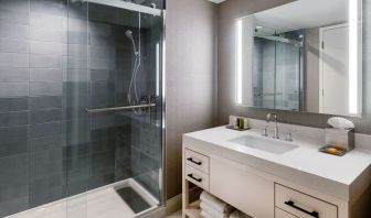 Guest bathroom with shower at Hilton Dallas Lincoln Centre.