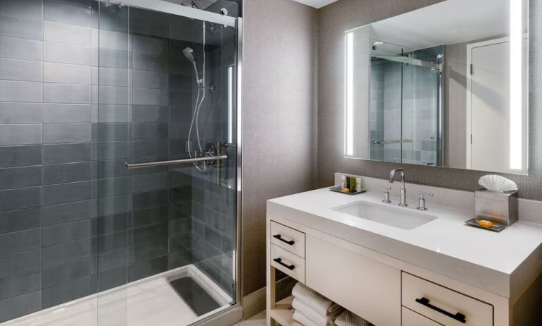 Guest bathroom with shower at Hilton Dallas Lincoln Centre.