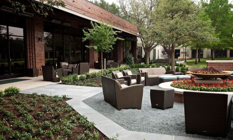 Firepit surrounded by outdoor furniture at Hilton Anatole.