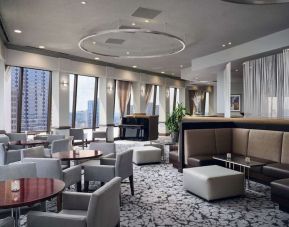 Dining area with natural light perfect for coworking at Hilton Atlanta.