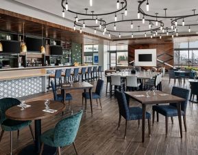 Dining area with natural light perfect for coworking at Hilton Garden Inn Camden Waterfront Philadelphia.