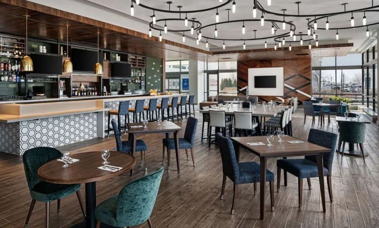 Dining area with natural light perfect for coworking at Hilton Garden Inn Camden Waterfront Philadelphia.