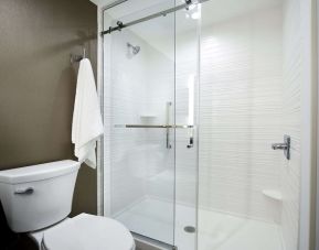 Guest bathroom with shower at Hilton Garden Inn Camden Waterfront Philadelphia.