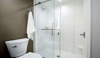 Guest bathroom with shower at Hilton Garden Inn Camden Waterfront Philadelphia.