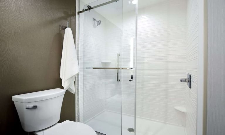 Guest bathroom with shower at Hilton Garden Inn Camden Waterfront Philadelphia.