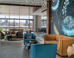 Lobby and coworking lounge at Hilton Garden Inn Camden Waterfront Philadelphia.