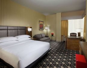 Day use room with work desk and sofa at Hilton Chicago-Northbrook.