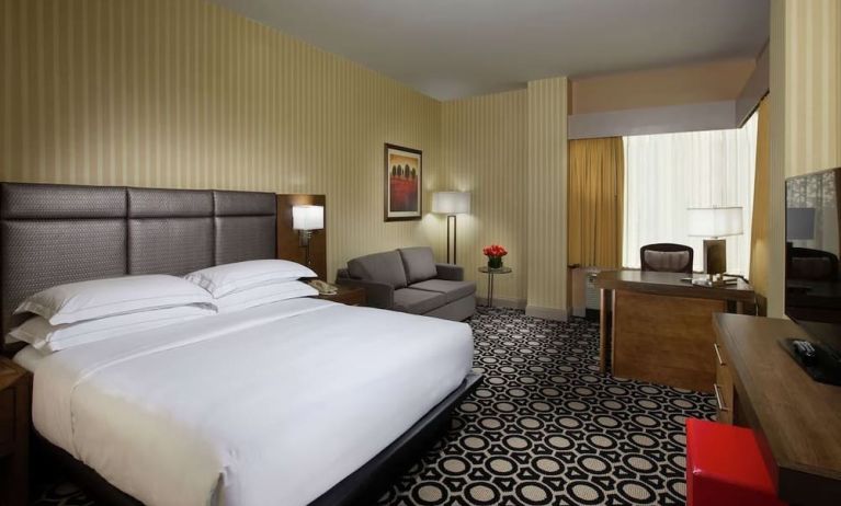 Day use room with work desk and sofa at Hilton Chicago-Northbrook.