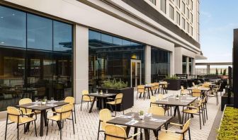 Hotel terrace with seating at Hilton BNA Nashville Airport Terminal.
