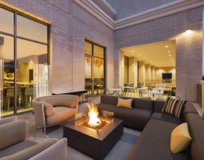 Hotel terrace with lounge area and fireplace at Hilton Garden Inn Nashville West End Avenue.