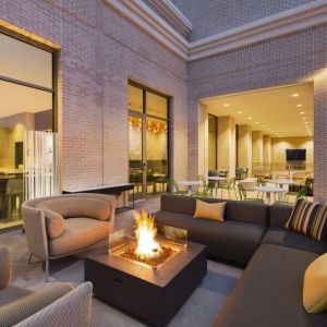 Hotel terrace with lounge area and fireplace at Hilton Garden Inn Nashville West End Avenue.