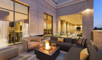 Hotel terrace with lounge area and fireplace at Hilton Garden Inn Nashville West End Avenue.