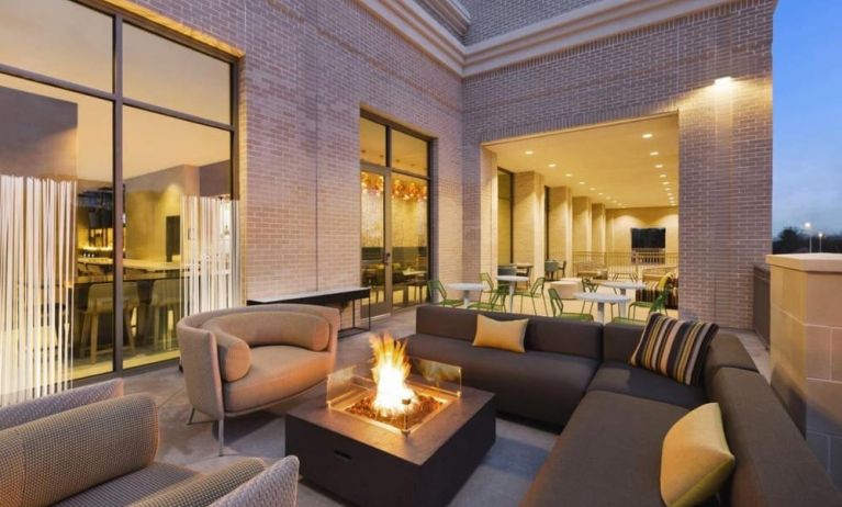 Hotel terrace with lounge area and fireplace at Hilton Garden Inn Nashville West End Avenue.