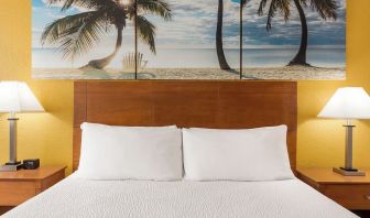 King bed at EnVision Hotel Miami International Airport.