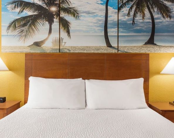 King bed at EnVision Hotel Miami International Airport.