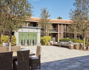 Garden with outdoor furniture at DoubleTree By Hilton Orlando At SeaWorld.