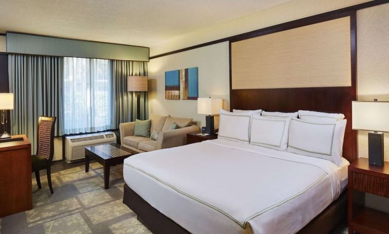 Day use room with sofa and work desk at DoubleTree By Hilton Orlando At SeaWorld.