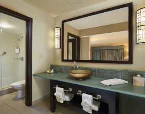 Guest bathroom with shower at DoubleTree By Hilton Orlando At SeaWorld.