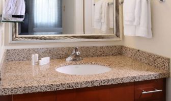 Private guest bathroom with shower and free toiletries at Sonesta ES Suites Dallas Medical Market Center.