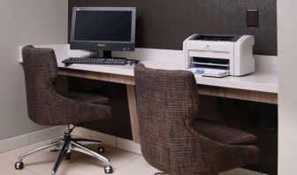 Business center with computer, printer and comfortable seating at Sonesta ES Suites Dallas Medical Market Center.