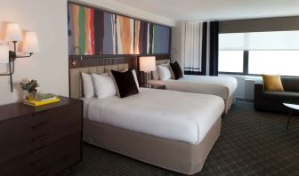 Day use twin room with lounge area at The Fifty Sonesta Select New York.