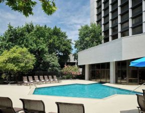 Outdoor pool with lounge chairs at Sonesta Nashville Airport.