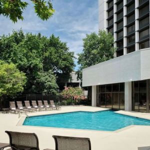 Outdoor pool with lounge chairs at Sonesta Nashville Airport.