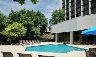 Outdoor pool with lounge chairs at Sonesta Nashville Airport.