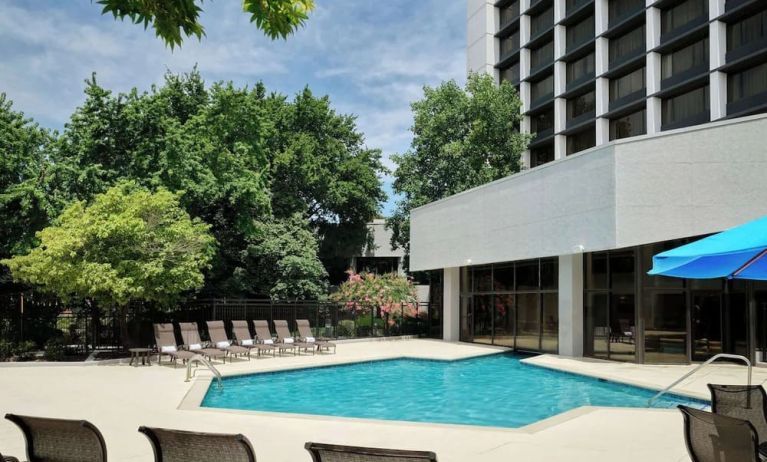 Outdoor pool with lounge chairs at Sonesta Nashville Airport.