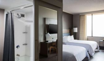 Day use twin room with work desk and privathe bathroom at Sonesta Nashville Airport.