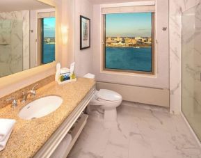 Guest bathroom with shower at Hilton Philadelphia At Penn's Landing.