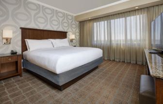 Comfortable king size bed at Embassy Suites By Hilton San Diego-La Jolla.