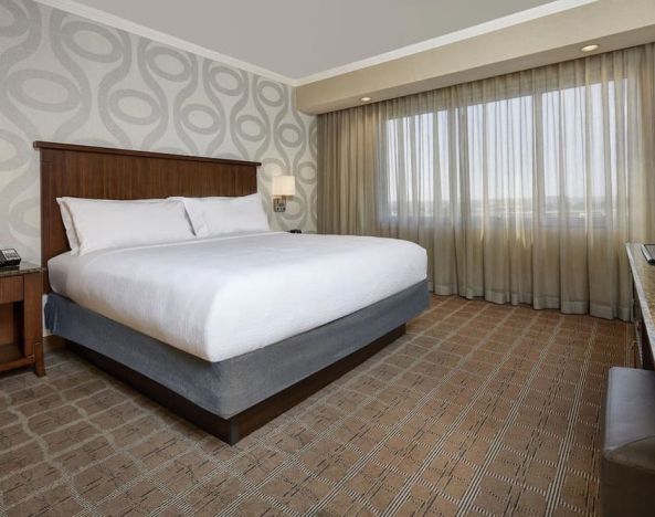 Comfortable king size bed at Embassy Suites By Hilton San Diego-La Jolla.