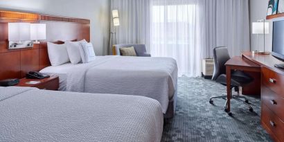 Bright and spacious day use twin room with work desk and floor to ceiling window at Sonesta Select Indianapolis Carmel.