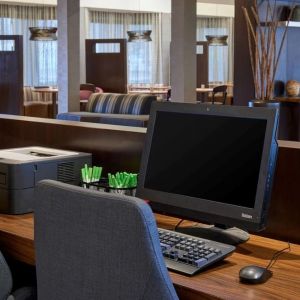 Business center with computer, printer and ergonomic chairs at Sonesta Select Indianapolis Carmel.