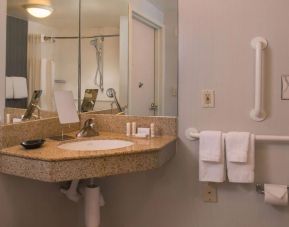 Private guest bathroom with shower and free toiletries at Sonesta Select Columbia.