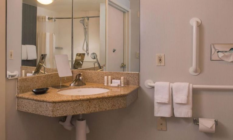 Private guest bathroom with shower and free toiletries at Sonesta Select Columbia.