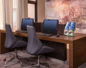 Business center with computers, printer and ergonomic chairs at Sonesta Select Columbia.