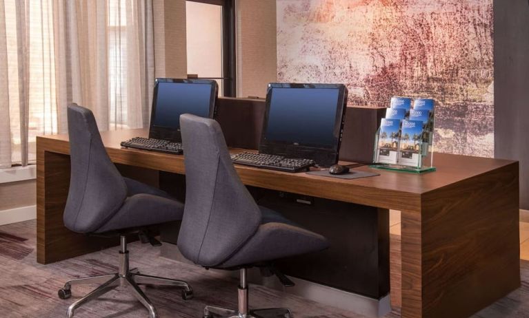 Business center with computers, printer and ergonomic chairs at Sonesta Select Columbia.