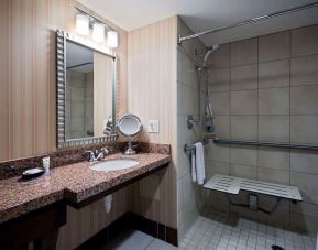 Private guest bathroom with shower at Sonesta Milwaukee West Wauwatosa.