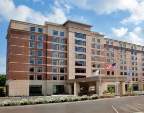 Hotel exterior and parking area at Sonesta Milwaukee West Wauwatosa.