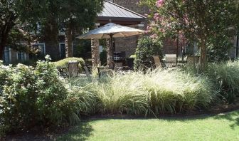 Patio with lounge seating at Sonesta ES Suites Dallas Las Colinas.