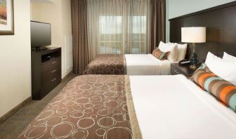 Day use twin room with floor to ceiling window at Sonesta ES Suites Dallas Las Colinas.