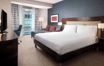 Day use room with work desk and sofa at Hilton Garden Inn Washington DC/Georgetown Area.