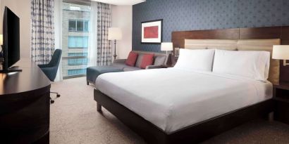 Day use room with work desk and sofa at Hilton Garden Inn Washington DC/Georgetown Area.