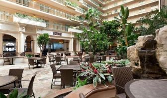 Breakfast area with natural light perfect for coworking at Embassy Suites By Hilton San Francisco Airport Waterfront.