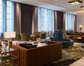 Comfortable and stylish lobby lounge with fireplace at The Allegro Royal Sonesta Hotel Chicago Loop.