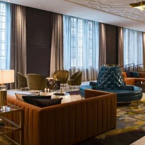 Comfortable and stylish lobby lounge with fireplace at The Allegro Royal Sonesta Hotel Chicago Loop.