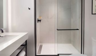 Private guest bathroom with shower at The Clift Royal Sonesta.