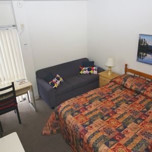 Standard day use room with sofa and work desk at Alexandra Hotel.